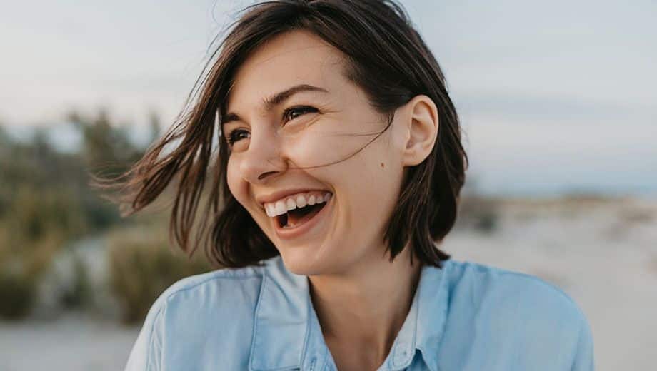 laughing woman at beach