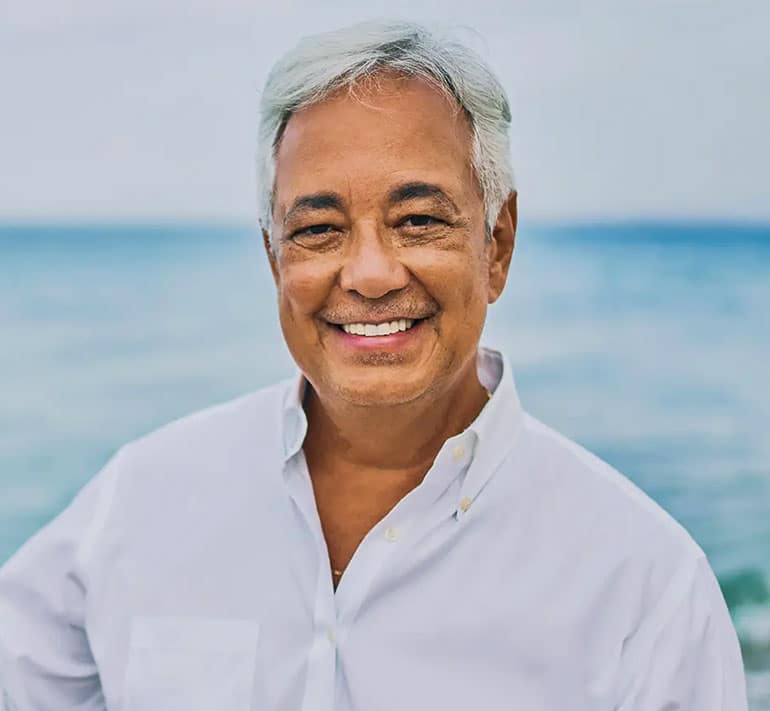 old smiling man at the beach