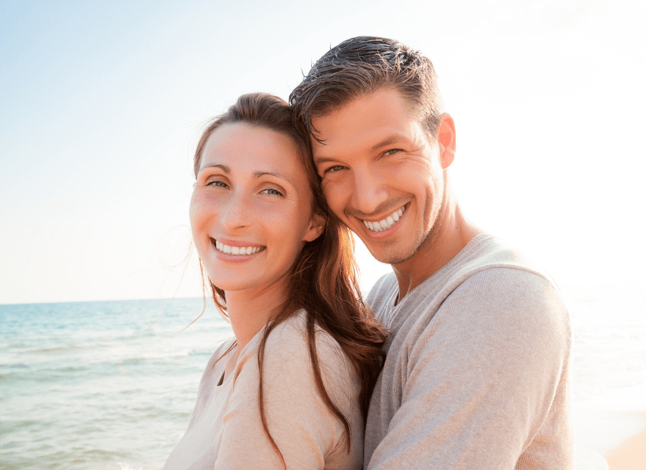 Smiling couple near the sea